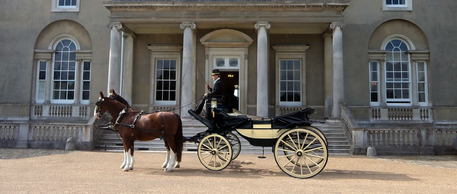Haydn Webb Carriages wedding horse drawn carriage outside stately home